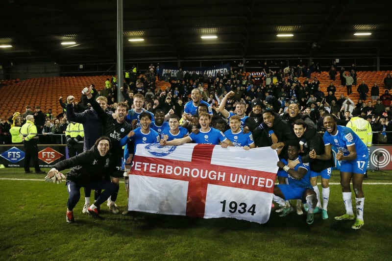 Posh celebrate pitchside at Bloomfield Road in front of their fans.