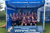 The trophy-winning Peterborough Sports Under 15 girls team.