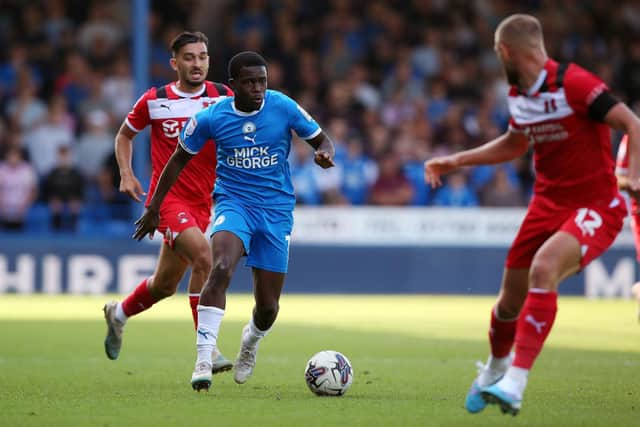 Kwame Poku of Peterborough United takes on the Leyton Orient defence. Photo: Joe Dent/theposh.com.