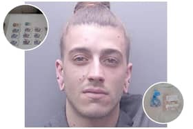 Jack Defraine with some of the cash and drugs seized by police