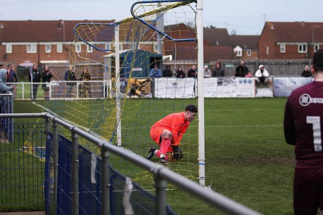 Peterborough Sports goalkeeper Frankie Taylor saves a Posh penalty. Photo: Tim Symonds.