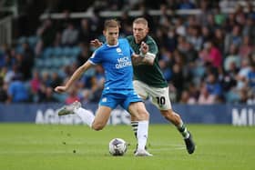 Martyn Waghorn of Derby County (green) in action at Posh in August, 2023. Photo Joe Dent/theposh.com