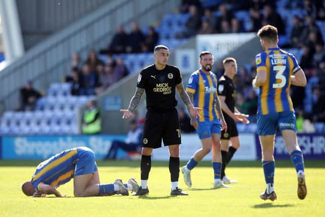 Oliver Norburn of Peterborough United reacts after committing a foul against Shrewsbury Town. Photo: Joe Dent/theposh.com