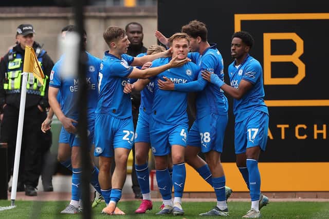 Posh celebrate Archie Collins' match-winning strike. Photo Joe Dent/theposh.com