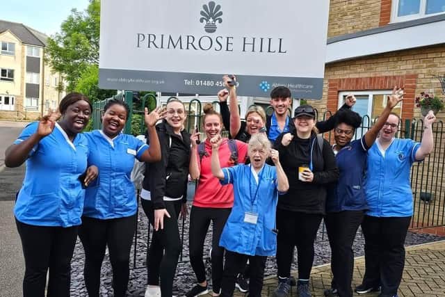 Staff cheering on the walkers as they begin their trek