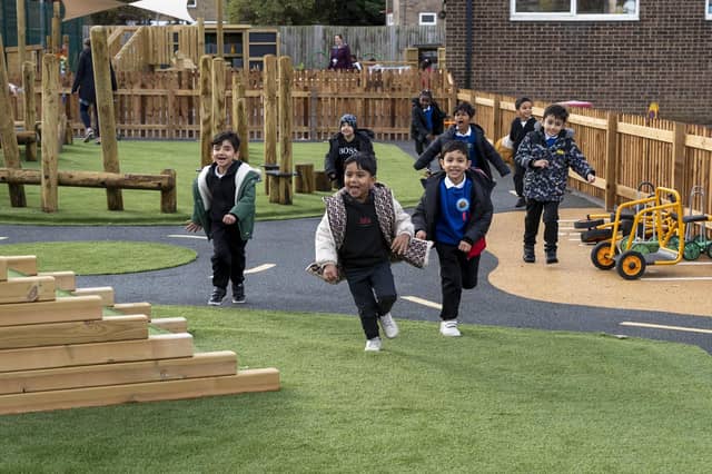 Children enjoying the new outdoor play area.