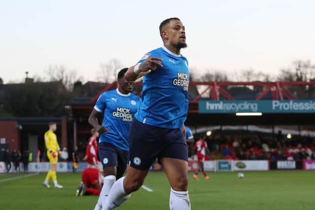 Jonson Clarke-Harris celebrates his 25th League One goal of the season at Accrington on Tuesday. Photo: Joe Dent/theposh.com.