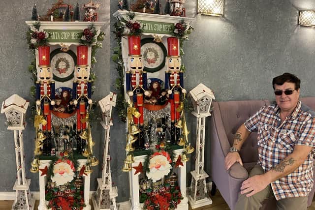 Mick and the clock he has created for Ashlynn Grange care home.