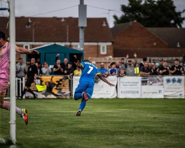 Dion Sembie-Ferris wheels away in delight after scoring for Peterborough Sports against King's Lynn. The Lynn goalkeeper is forrmer Posh number one Paul Jones. Photo: James Richardson.