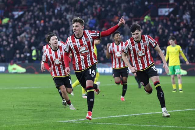 Harrison Burrows celebrates a Sheffield United goal. Photo by Alex Livesey/Getty Images.