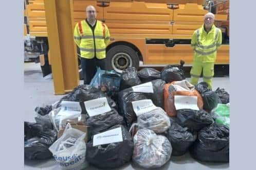 National Highways Inspector Rob Taylor (left) and and Lee Greenacre, Supervisor, Ringway, with some of the donations.