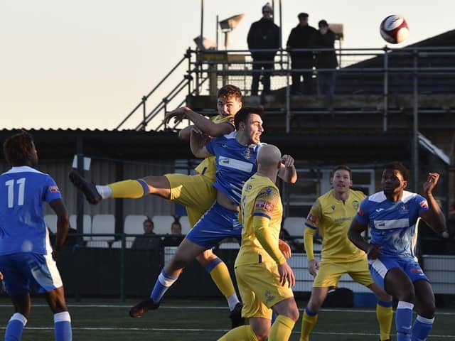 Sam Cartwright (yellow, highest) scored for Spalding United at Shepshed Dynamo.