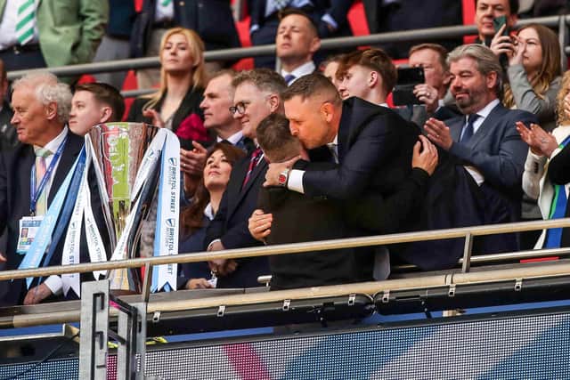 Posh chairman Darragh MacAnthony embraces manager Darren Ferguson in the Royal Box after the Wembley win. Photo Joe Dent/theposh.com.