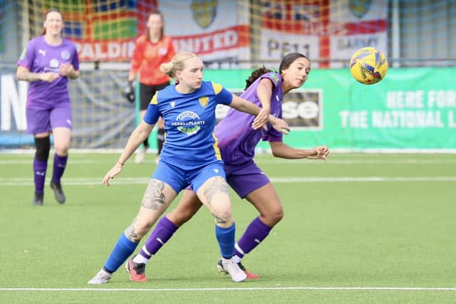 Action from Spalding United (blue) and Stanground Cardea Sports in the Women's FA Cup. Photo Jason Richardson.