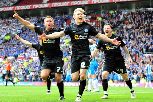 Craig Mackail-Smith celebrates his goal for Posh in the 2011 League One play-off final at Old Trafford.