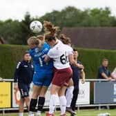 Katie Middleton of Posh Women in an aerial duel during the National League game with Northampton. Photo: Ruby Red Photography