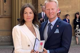 Entrepreneur Scott Weavers-Wright and his wife Elaine with the OBE presented to him by Princess Anne for his services to technology and retail.