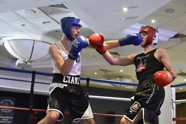 Peterborough Police boxing club boxer (blue) Dom Ciani defeats Reece Bird during a Peterborough United/CAMPOL boxing show at the Holiday Inn in 2019.