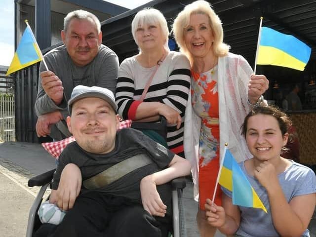 Max Yaschenko, who uses a wheelchair, and his parents, Vitaliy, 58, and Sveta, 59 lost their home in a village near Chernihiv, Ukraine, when it was bombed in March last year. The family escaped the country with help from local church members - taking just a carrier bag full of possessions with them. John and Rosie Sandall, who have been friends with Max and his family for 25 years, kindly welcomed them into their home with open arms.