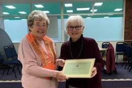 Joan Robinson (right) receives a NWBF life membership certificate from county president Jess Bolam.