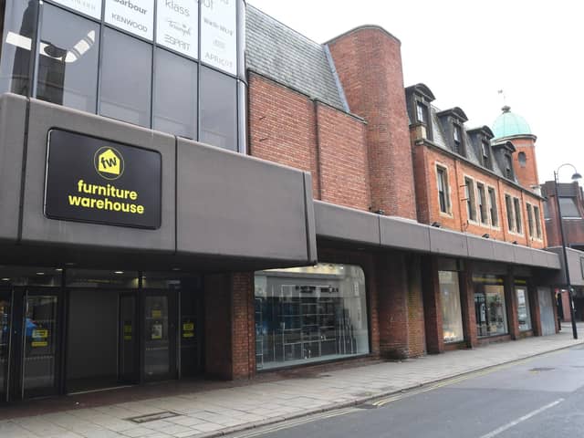 The new Furniture Warehouse branding on the former Beales department store in Westgate, Peterborough