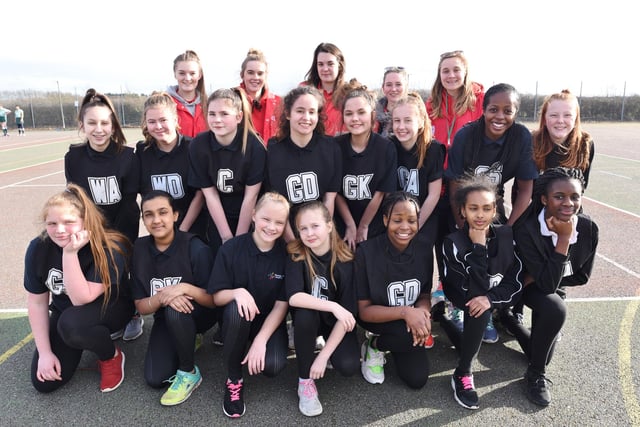 Pictured are the AMVC event leaders with teams from Thomas Deacon Academy during a netball tournament at the college.