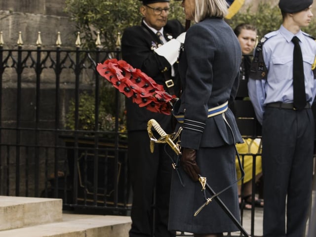 RAF Wittering Station Commander, Wing Commander Nikki Duncan lays at wreath at the town’s
War Memorial.