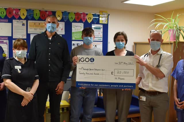 Staff from iGO4 present the cheque to staff at Peterborough City Hospital's Neonatal Intensive Care Unit.