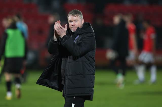 Peterborough United Manager Grant McCann acknowledges the supporters after Wednesday's victory over Salford. Photo: Joe Dent.