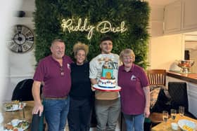 Nigel Cook Ruddy Duck Landlord, left,  Jo the chef and Annette, the barmaid present Matty with a special cake to celebrate his victory.