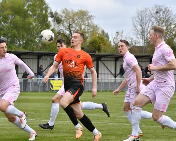 Dan Jarvis (orange) in action for Peterborough Sports against Chorley. Photo David Lowndes.