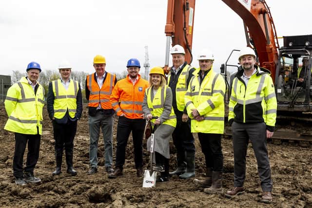 Ground-breaking:  Sarah-Jayne Littlewood (DHL) puts the first spade in the ground to get construction under way on two units at Lightning Park, Huntingdon, with, from left, Kevin Malle (Trebor Developments), Patrick Stanton (Bidwells), Chris Mann (DHL), Greg Dalton (Trebor Developments), Tom Sanderson (Huntingdonshire District Council), Jonathon Walshe (GMI) and Dominic Jefferson (DHL)