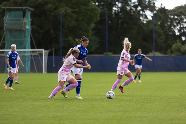 Elie York (pink, left) and Sophie Scargill in action for Posh at Ipswich. Photo: Ruby Red Photography