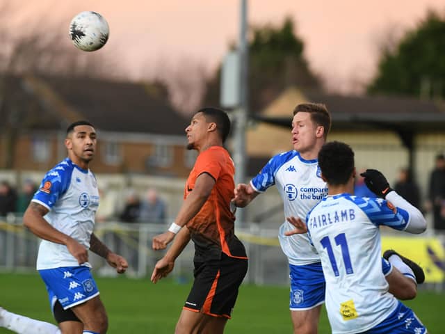 Kaine Felix (orange) in action for Peterborough Sports against Tamworth. Photo: David Lowndes.