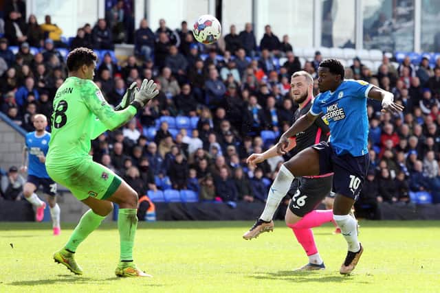 Ephron Mason-Clark of Peterborough United scores the second goal of the game against Exeter City. Photo: Joe Dent/theposh.com