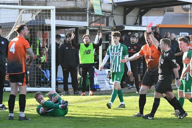 Peterborough Sports centre-back Ryan Fryatt (orange) is sent off in the game against Blyth Spartans. Photo David Lowndes.