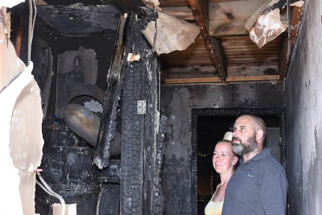 Eddie MacGregor and Esmerelda  at their home at Collingham, Orton Goldhay -  destroyed by fire following an  e-scooter battery fire