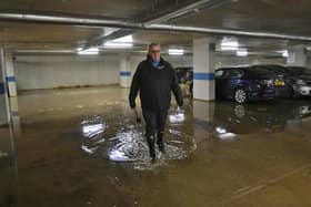 Reg Davies with the flooding problems in the car park at Clarkson House, Fletton Quays