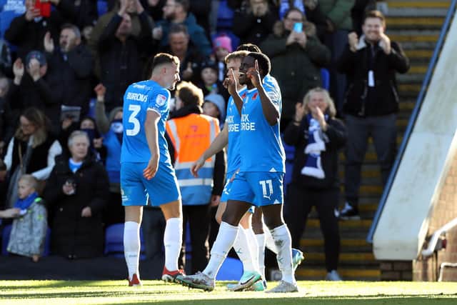 Kwame Poku celebrates scoring his second goal against Cambridge United. Photo: Joe Dent.