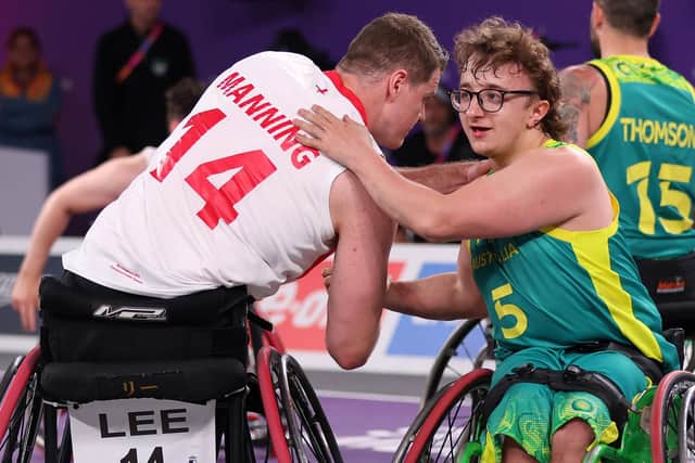 Lee Manning of Team England congratulates Lachlin DaltonTeam Australia on their win in the Men's Wheelchair 3x3 Basketball Semifinal match at the Commonwealth Games. (Photo by Luke Walker/Getty Images)