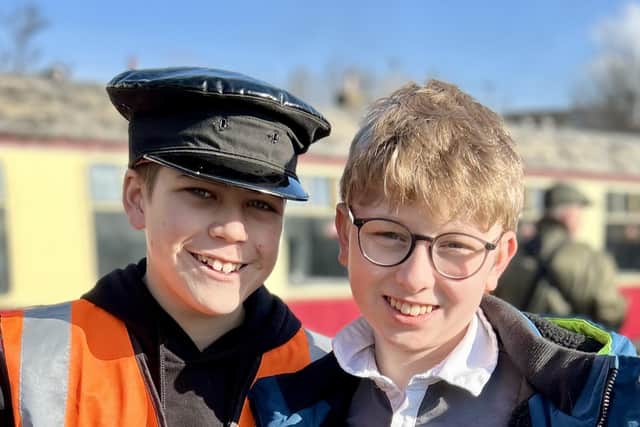 Harry Cowley (left) and Oliver Walker say they are "very proud" of their fundraising efforts, which have seen them raise more than £15,000 to help repair the arsoned NVR signal Box at Orton Mere.