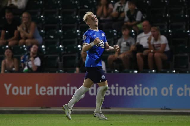 Joe Taylor of Peterborough United celebrates scoring his first senior goal in the EFL Cup win at Plymouth. Photo: Joe Dent/theposh.com.