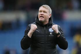 Peterborough United Manager Grant McCann celebrates victory over Oxford at full-time. Photo: Joe Dent.