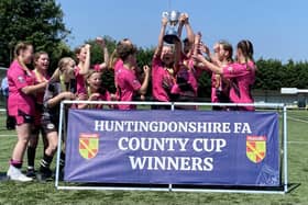 Girls United U16s celebrate their Hunts County Cup FInal triumph.