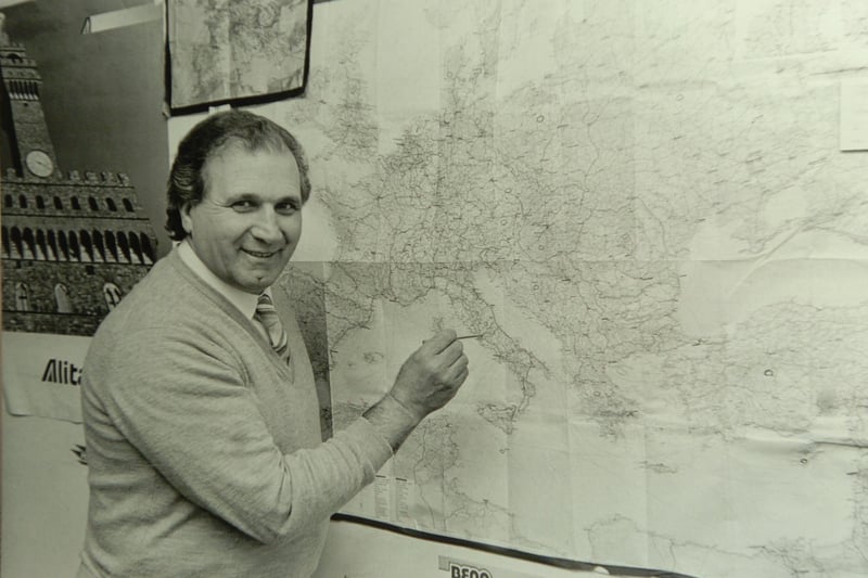 Carlo Broccoli points to a map of Italy.