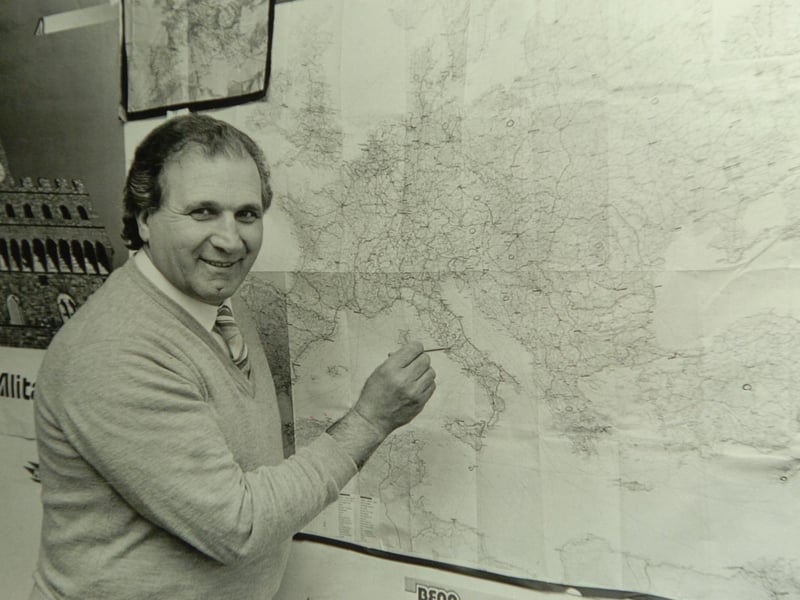 Carlo Broccoli points to a map of Italy.