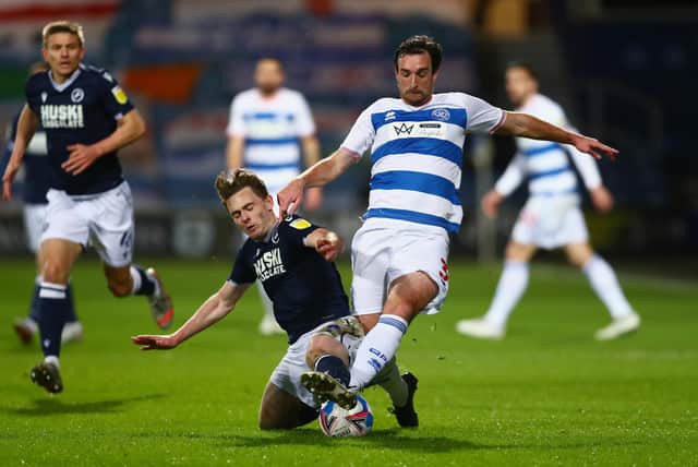 Ben Thompson makes a tackle for Millwall against QPR. (Photo by Clive Rose/Getty Images).