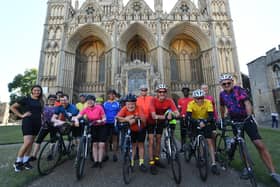 Sponsored cyclists leaving Peterborough Cathedral for a ride to Leicester in support of the Light Project, Peterborough