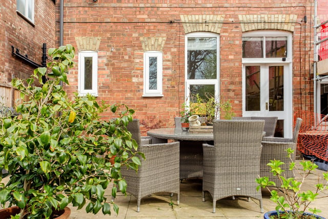 The enclosed rear garden is landscaped to include a paved seating area directly from the sitting room, ideal for entertaining in the warmer months.