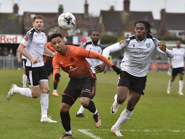 Dion Sembie-Ferris (orange) in action for Peterborough Sports against Bishop's Stortford. Photo: David Lowndes.